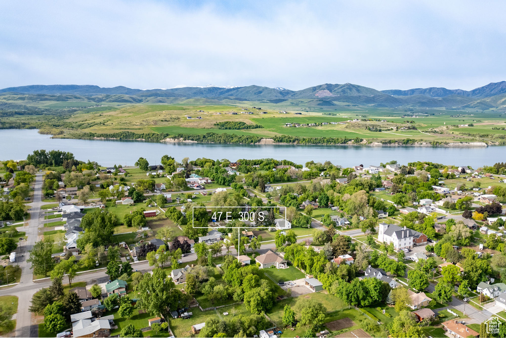 Aerial view of residential area featuring a water and mountain view