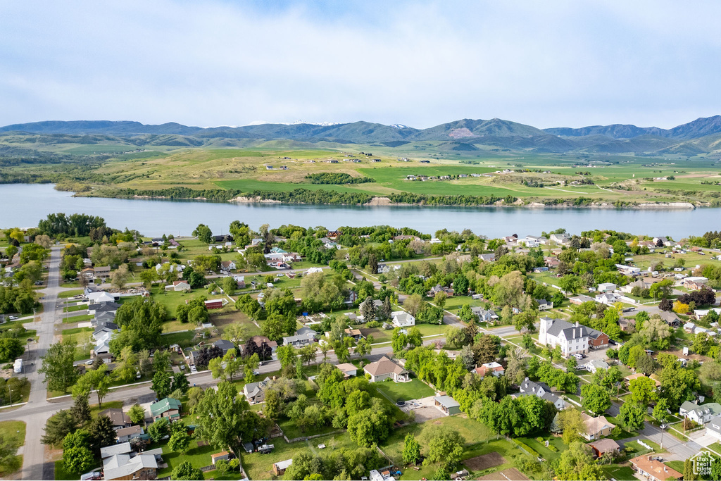 Aerial perspective of suburban area featuring a water and mountain view