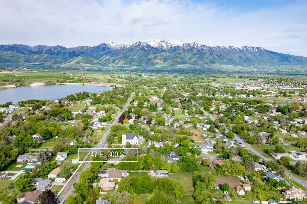 Aerial perspective of suburban area featuring a water and mountain view