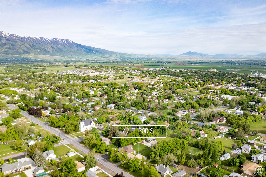 Aerial view of residential area featuring mountains