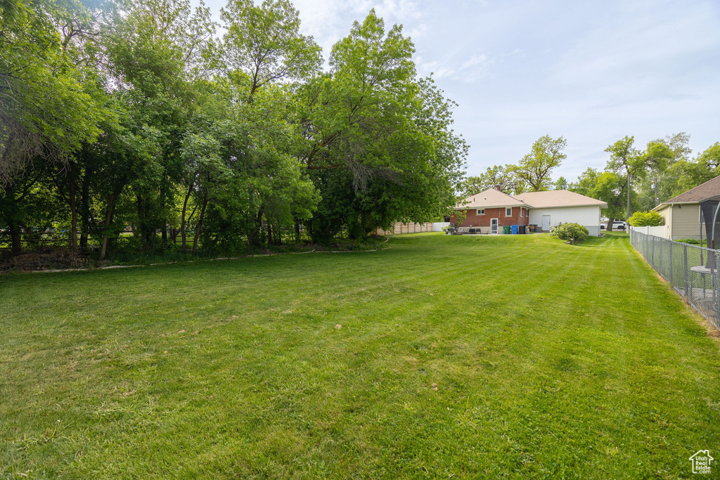 View of yard with fence