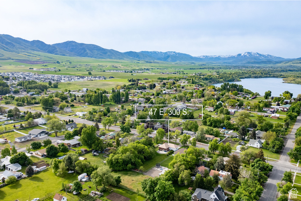 Aerial perspective of suburban area featuring a water and mountain view