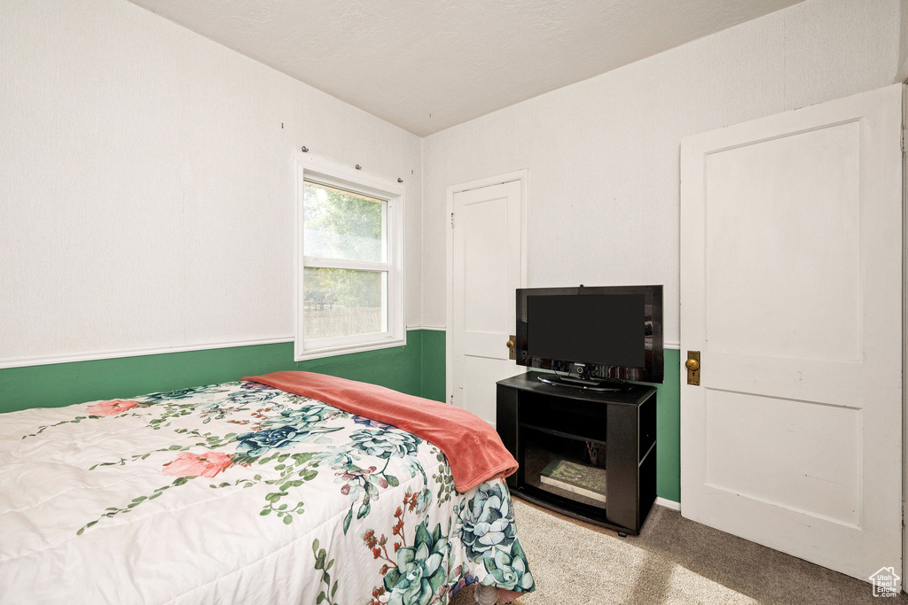 Bedroom featuring carpet floors