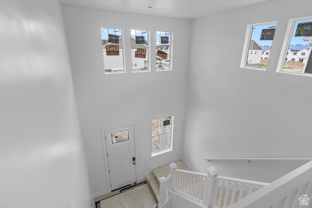 Foyer featuring healthy amount of natural light and baseboards