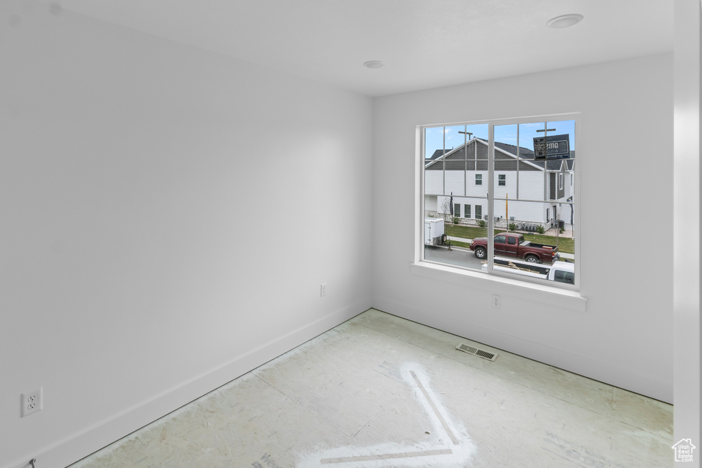 Unfurnished room featuring baseboards