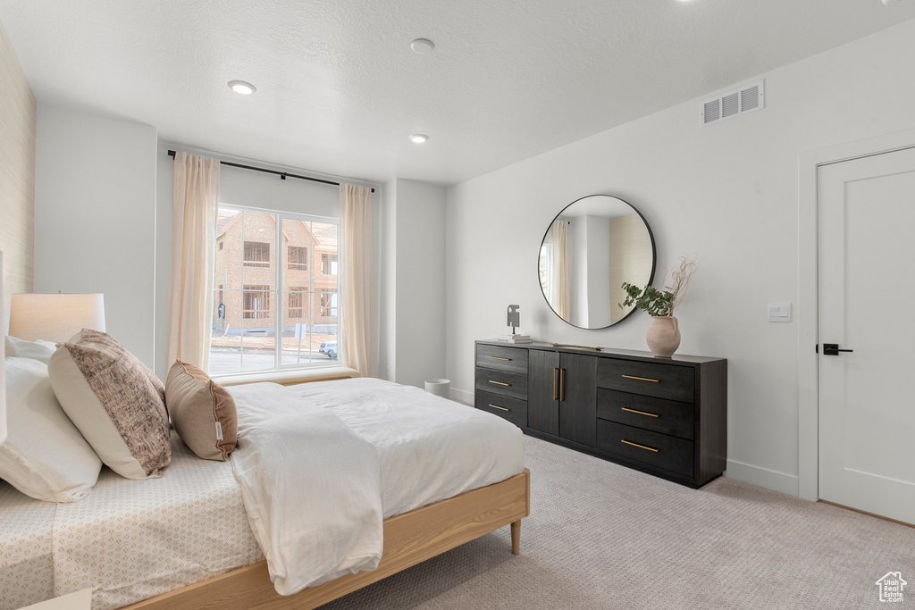 Bedroom with carpet, baseboards, and recessed lighting