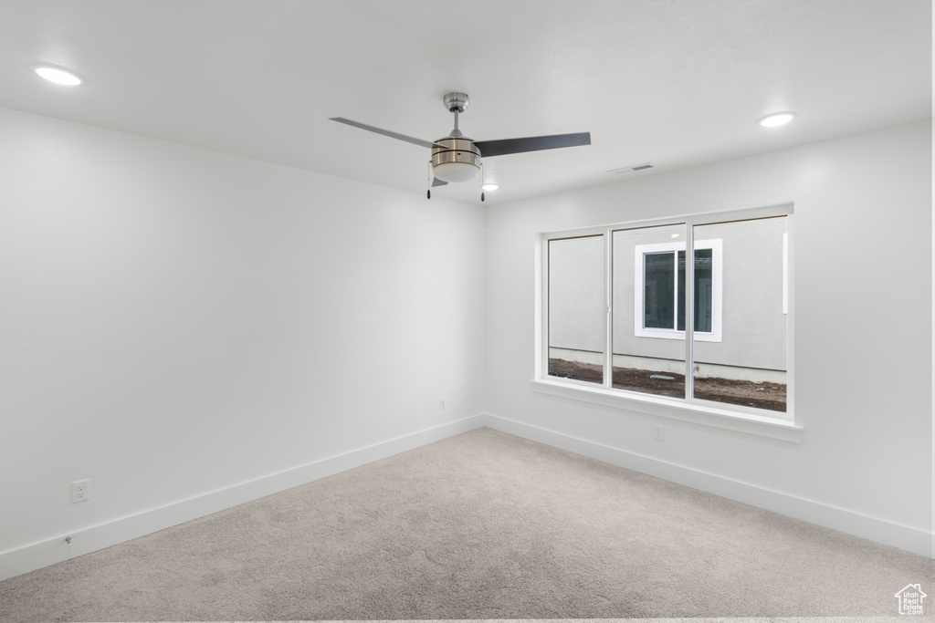 Unfurnished room with carpet, a ceiling fan, baseboards, and recessed lighting