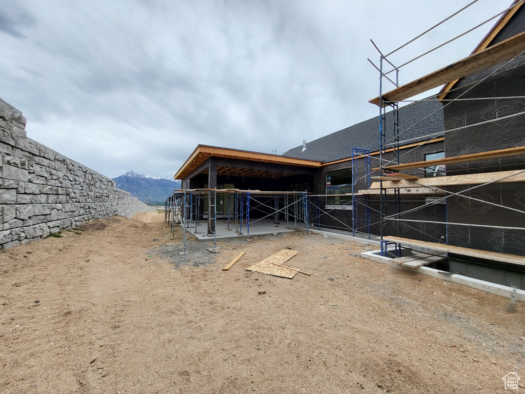 Rear view of house with a mountain view