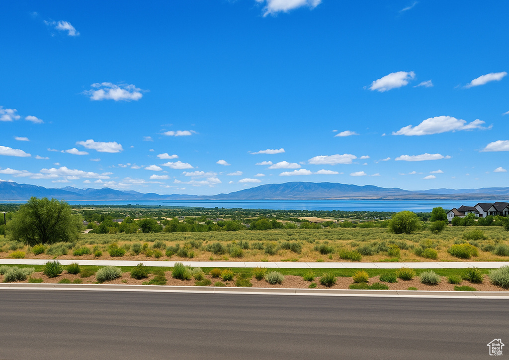 View of mountain backdrop featuring a large body of water