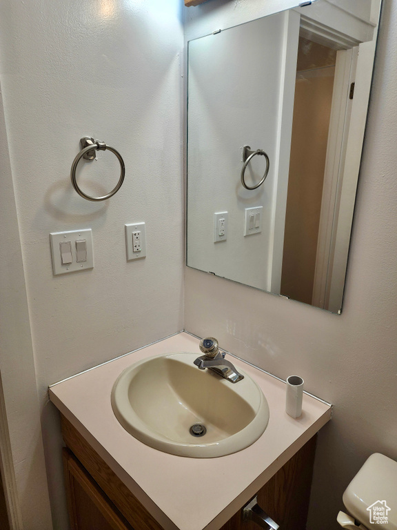 Bathroom with vanity and toilet