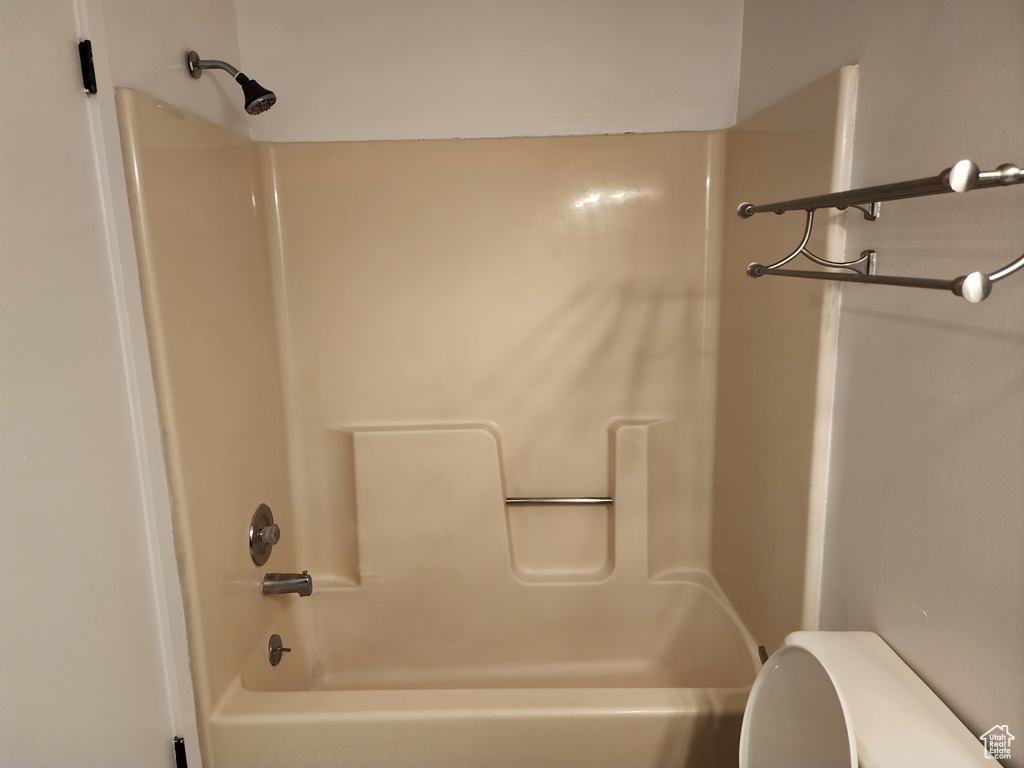 Full bath featuring toilet and shower / bathtub combination