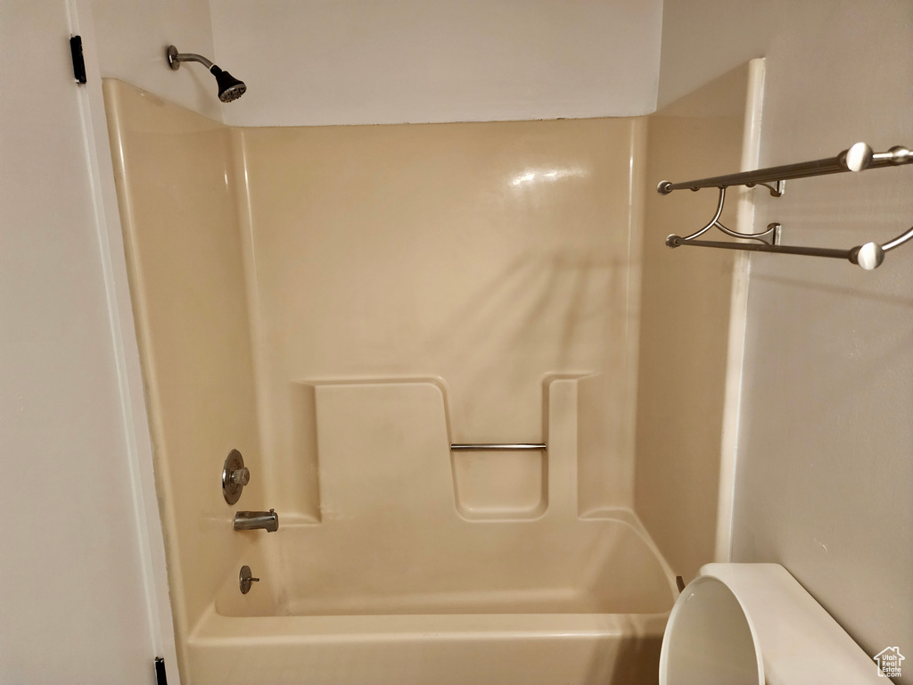 Bathroom with toilet and shower / tub combination
