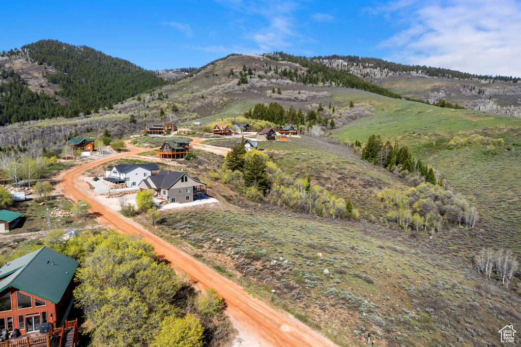 View of subject property featuring a mountainous background