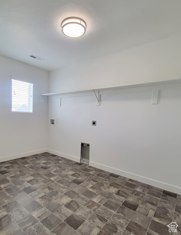 Clothes washing area featuring washer hookup, baseboards, and hookup for an electric dryer