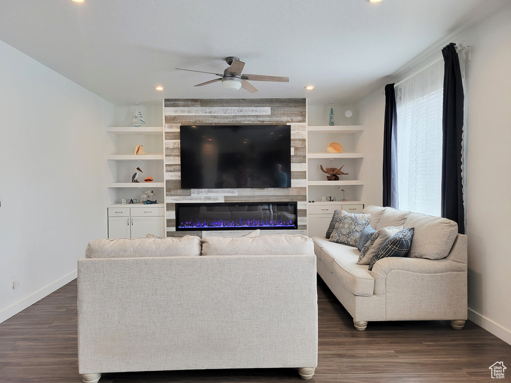 Living area with baseboards, a ceiling fan, dark wood-style floors, and recessed lighting