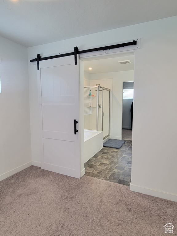 Full bathroom with carpet, a stall shower, baseboards, and a bath