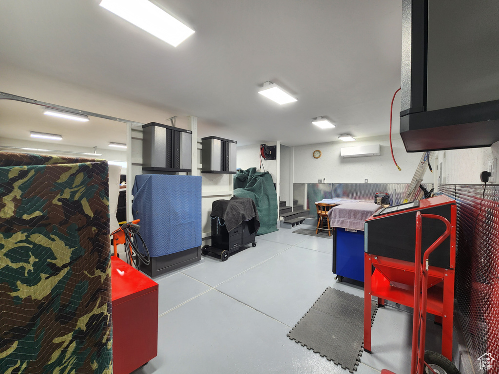 Garage featuring a wall unit AC