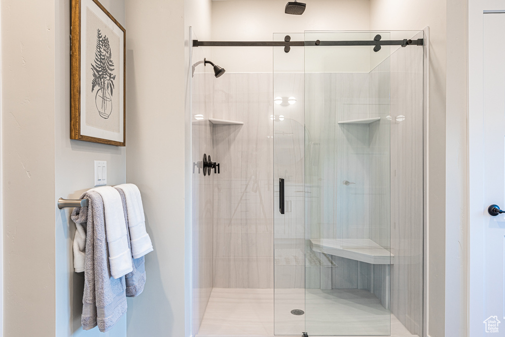 Full bath featuring a shower stall