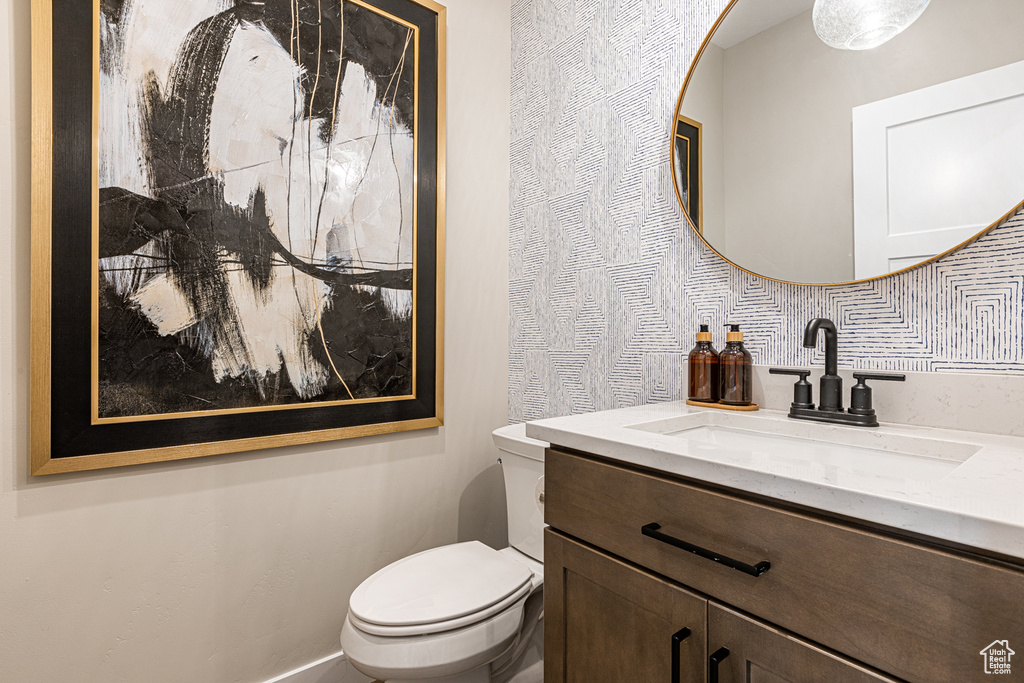 Half bath with toilet and vanity