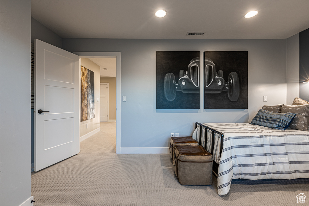 Carpeted bedroom with baseboards and recessed lighting