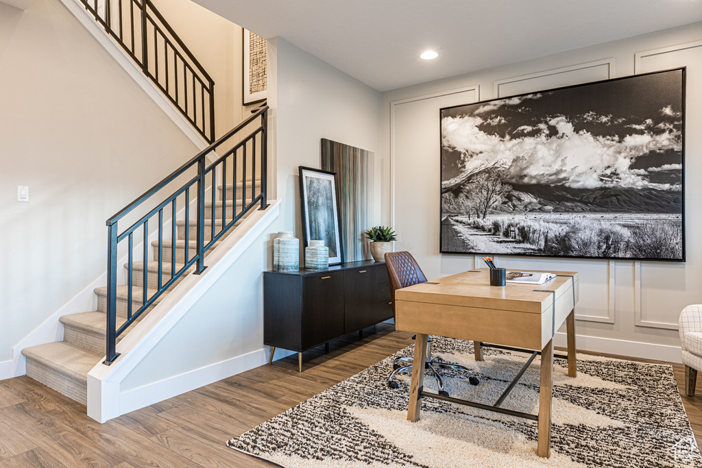 Office area with wood finished floors, baseboards, and recessed lighting
