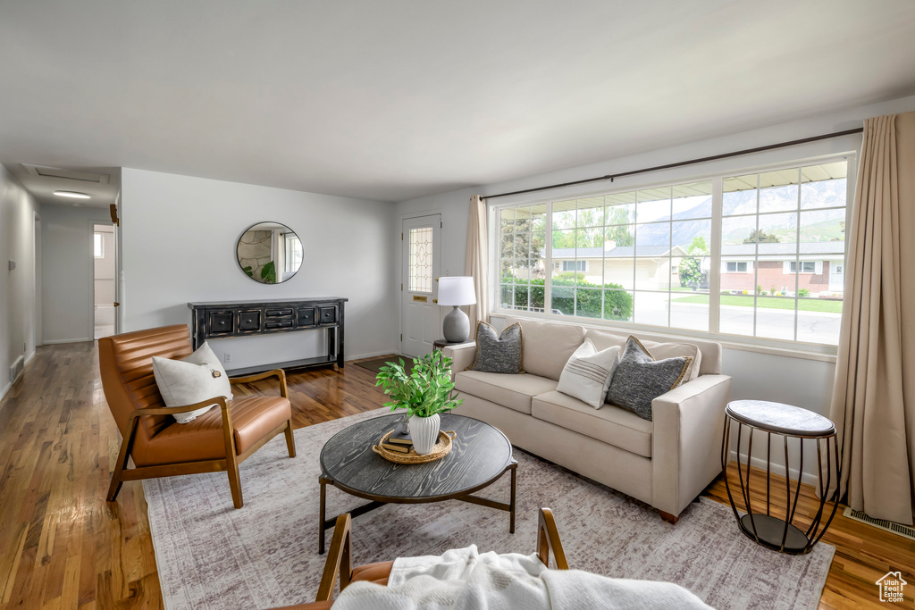 Living room featuring wood finished floors and baseboards