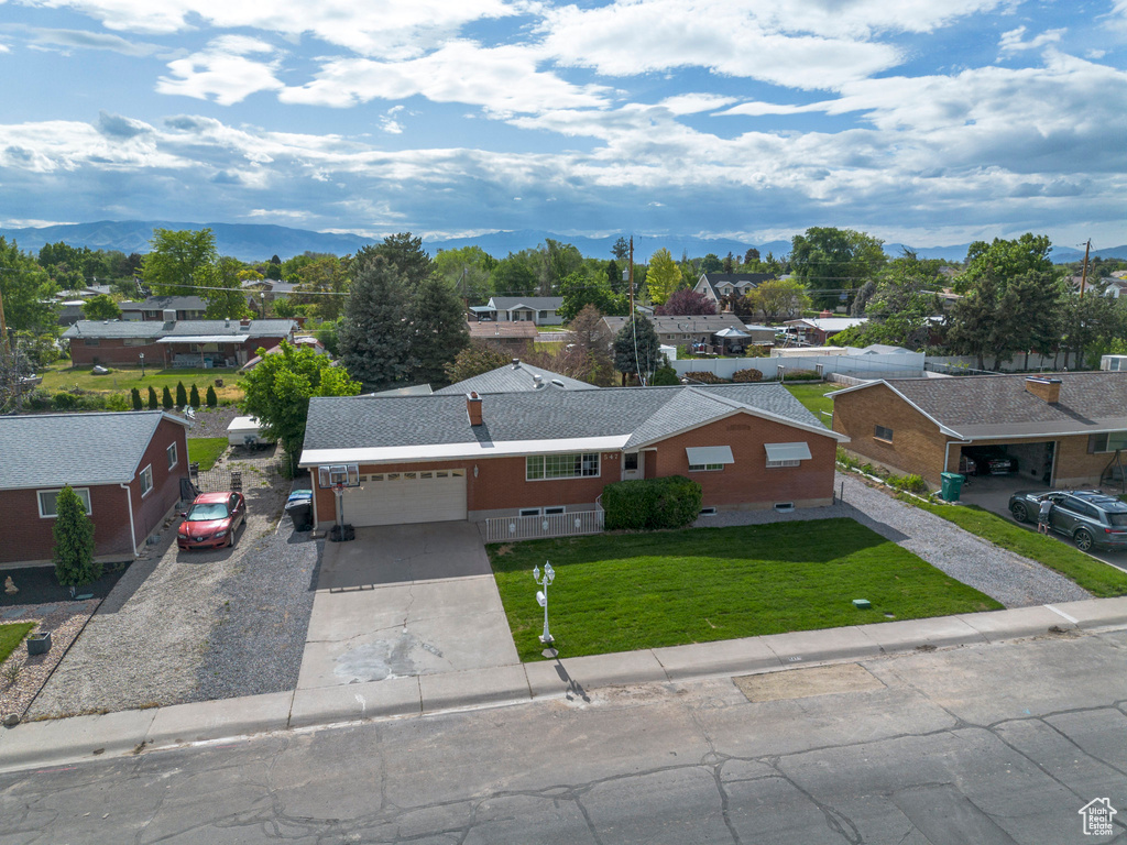 Aerial perspective of suburban area featuring a mountainous background