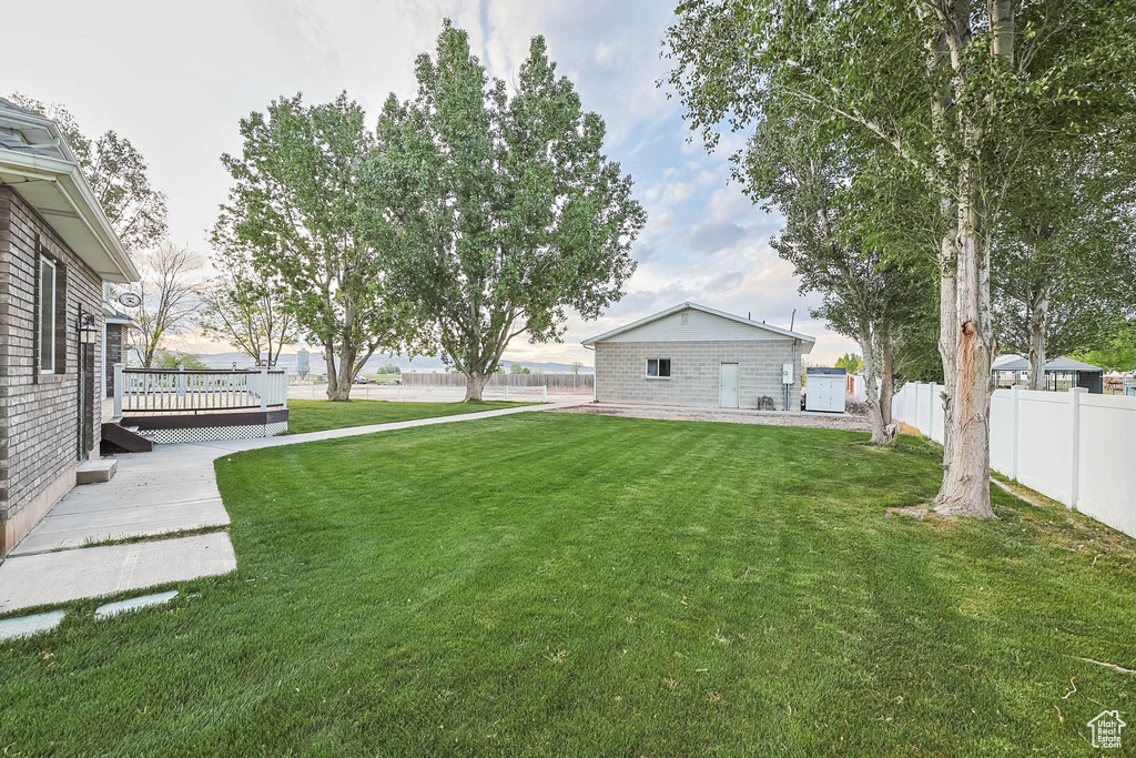 View of yard with a wooden deck