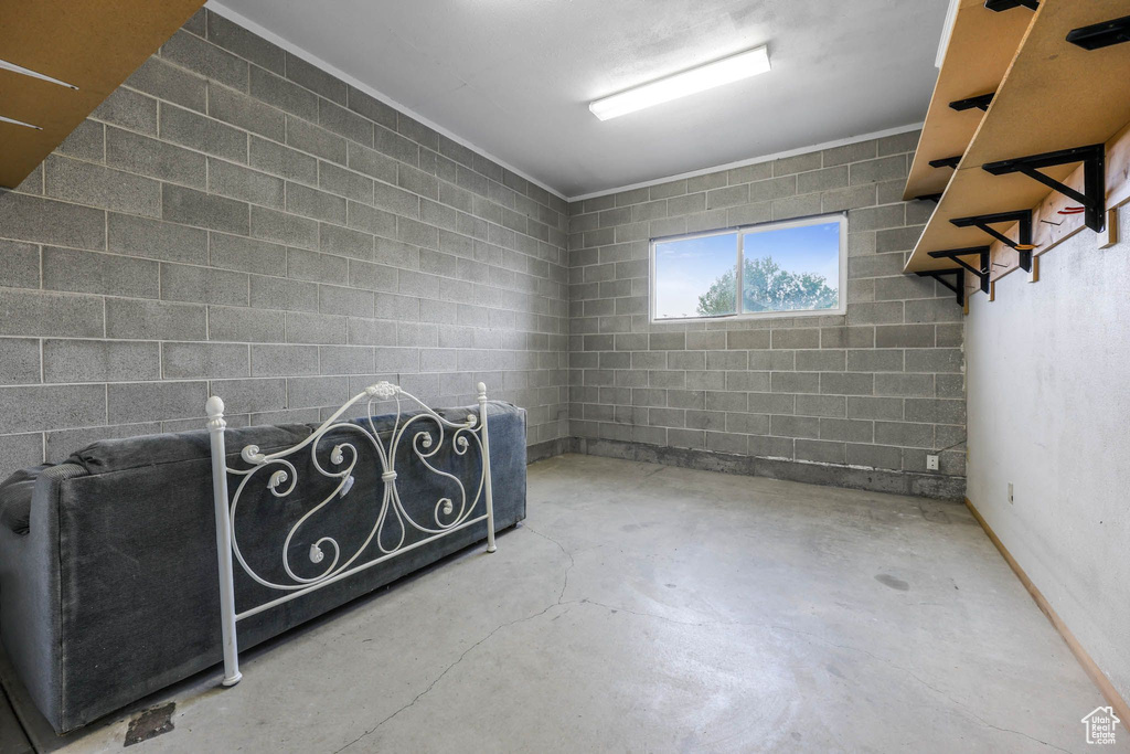 Basement featuring concrete block wall