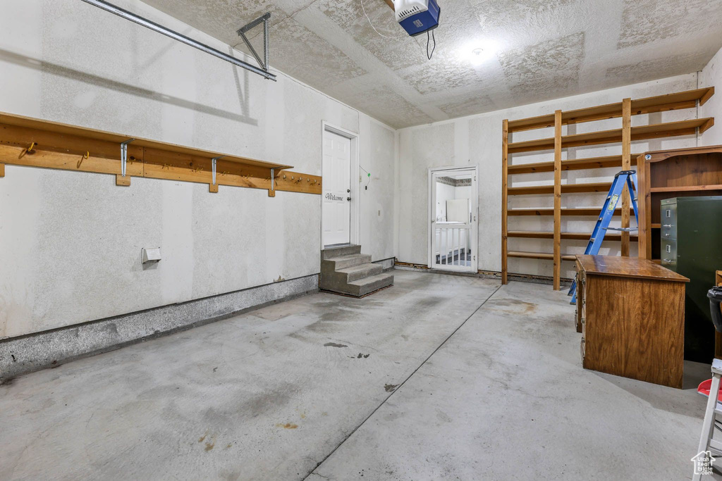 Garage featuring a garage door opener