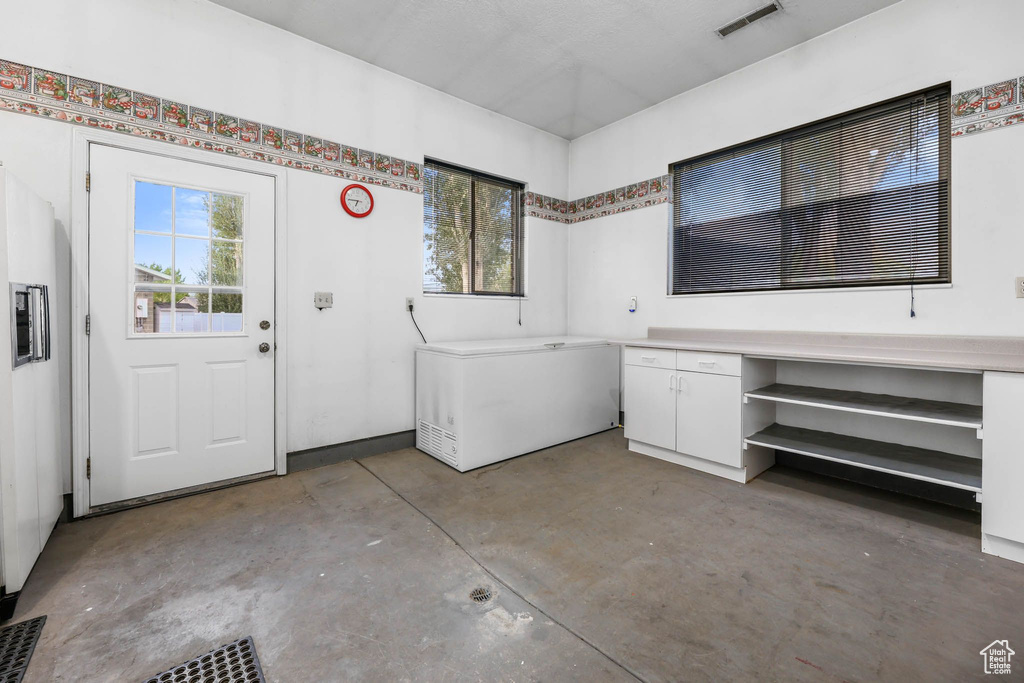 Clothes washing area with cabinet space