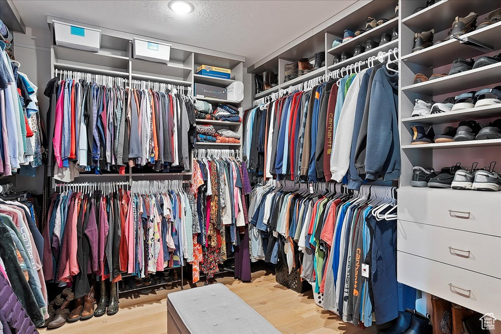 Spacious closet with wood finished floors