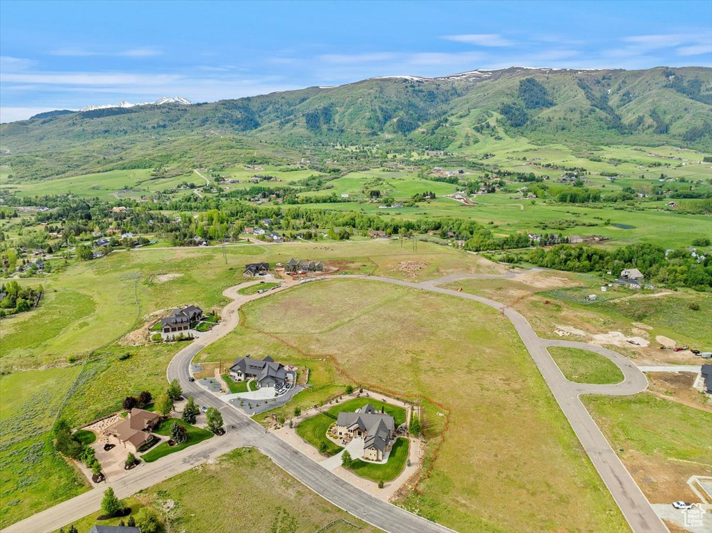 Aerial view of property\'s location with a mountainous background