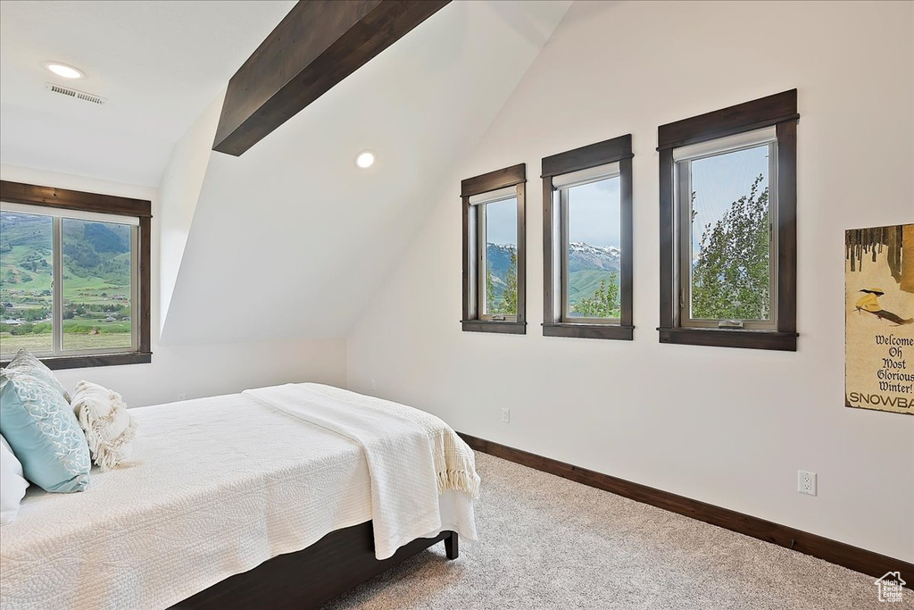 Carpeted bedroom with lofted ceiling, baseboards, and recessed lighting