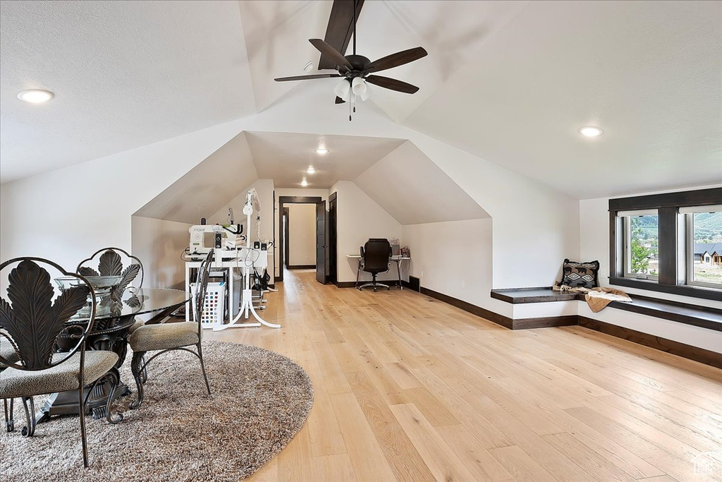Bonus room with lofted ceiling, ceiling fan, light wood-style floors, baseboards, and recessed lighting
