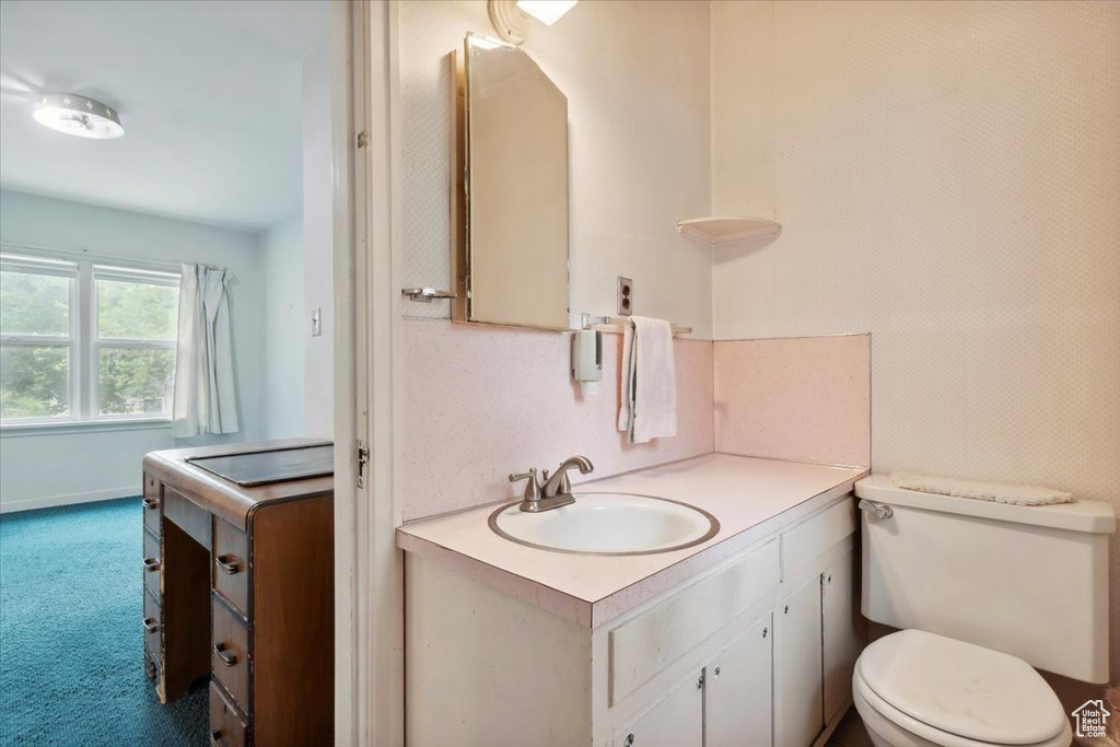 Bathroom with vanity and toilet