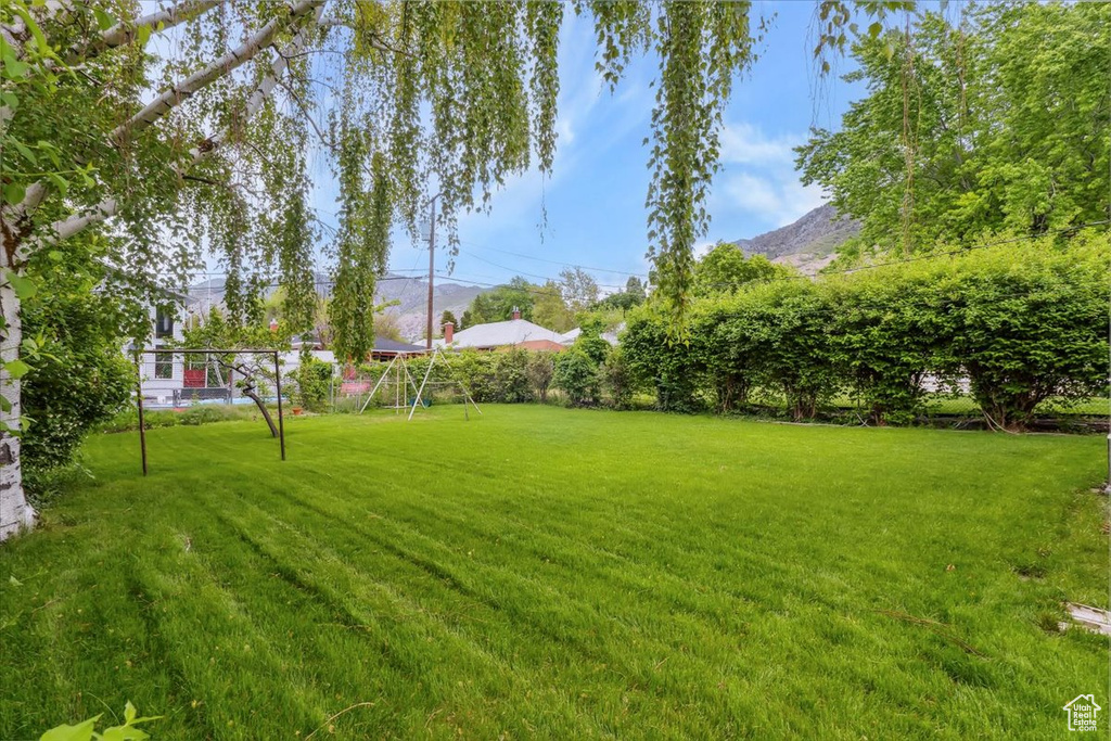 View of green lawn with a mountain view