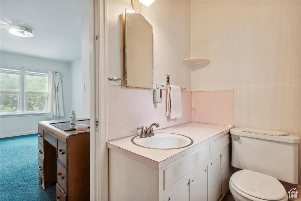 Bathroom with vanity and toilet
