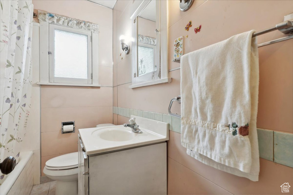 Full bath with toilet and vanity
