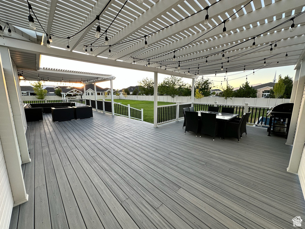 Deck featuring outdoor lounge area, outdoor dining area, a pergola, and a grill