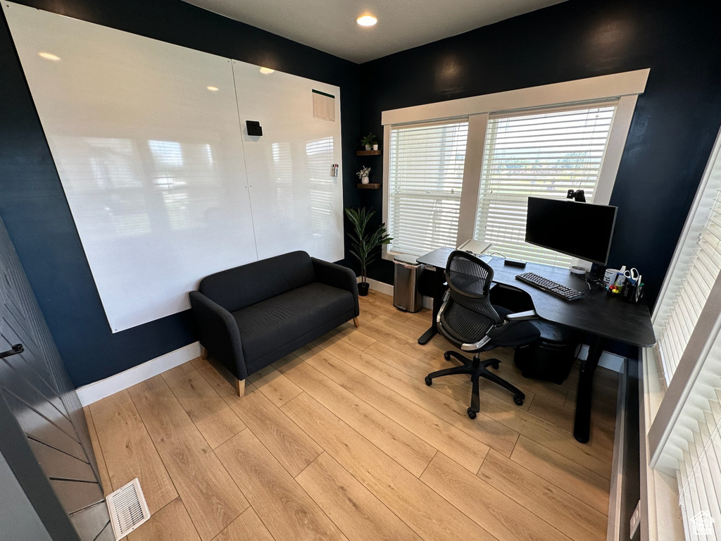 Home office with light wood finished floors, baseboards, and recessed lighting