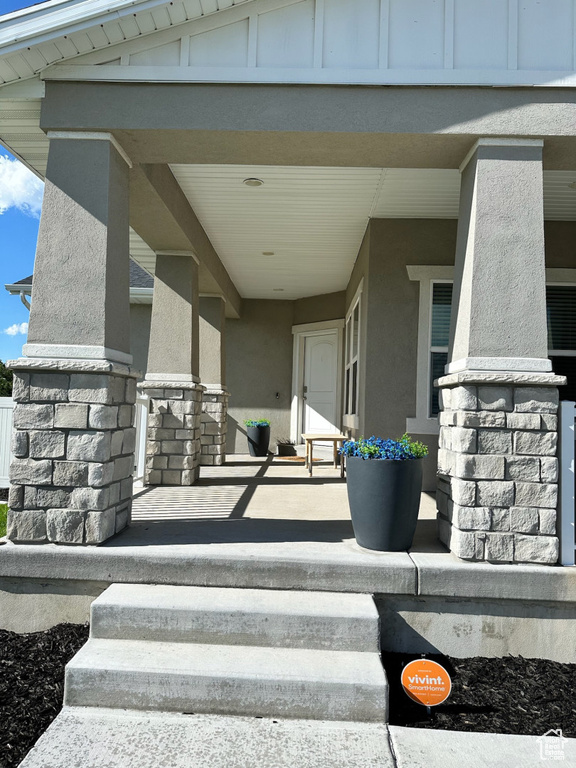 View of patio featuring a porch