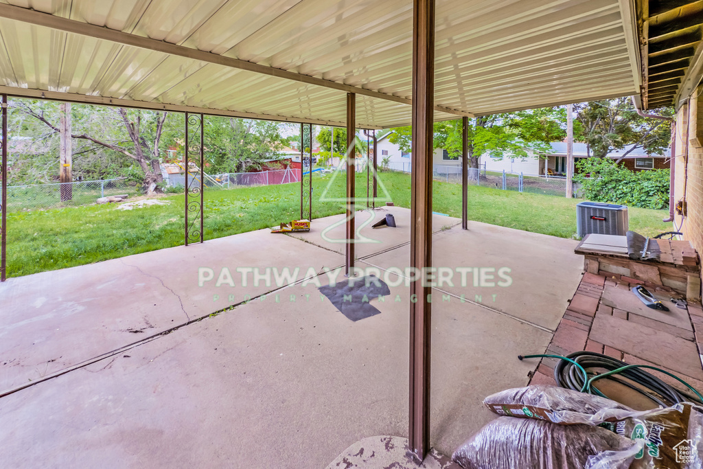 View of patio / terrace featuring central AC unit and a playground