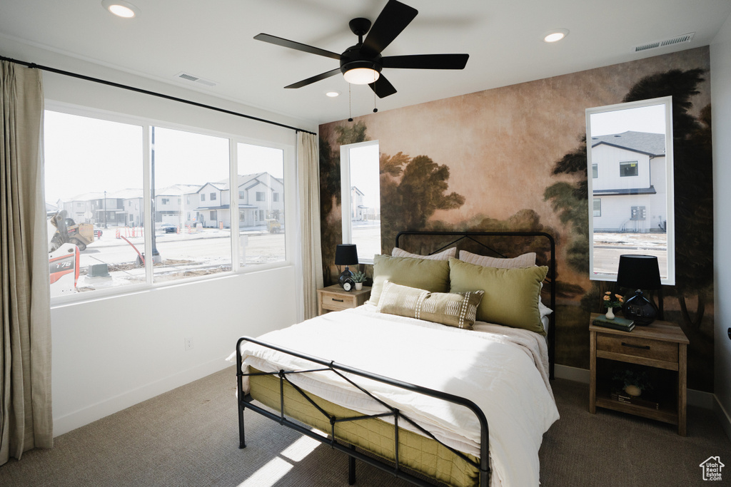 Bedroom featuring multiple windows, carpet, baseboards, recessed lighting, and ceiling fan
