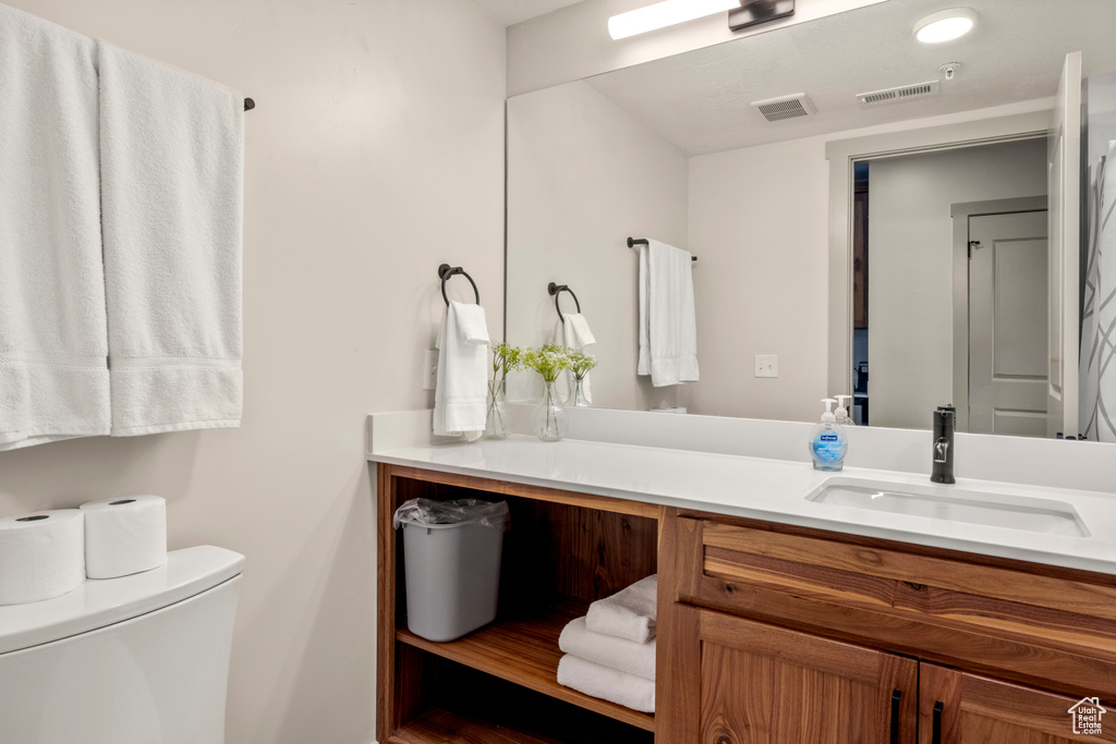 Bathroom with vanity and toilet