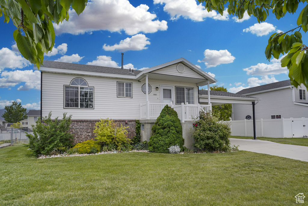 Single story home featuring driveway and brick siding