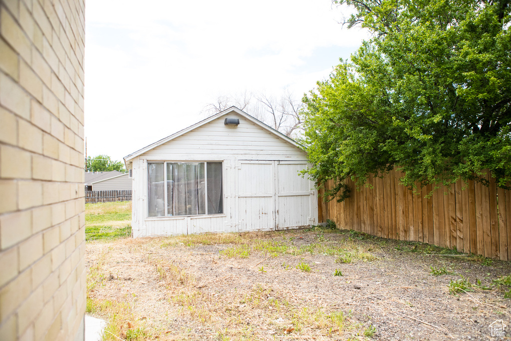 View of home's exterior featuring fence