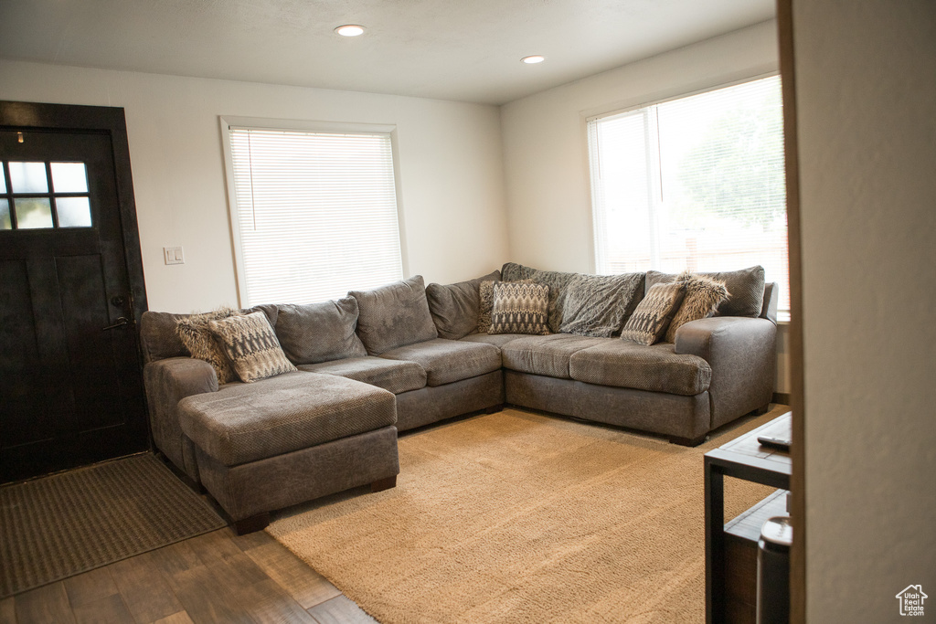 Living area featuring wood finished floors and recessed lighting