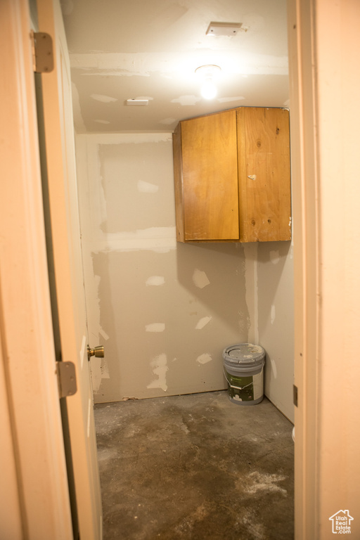 Bathroom with unfinished concrete floors