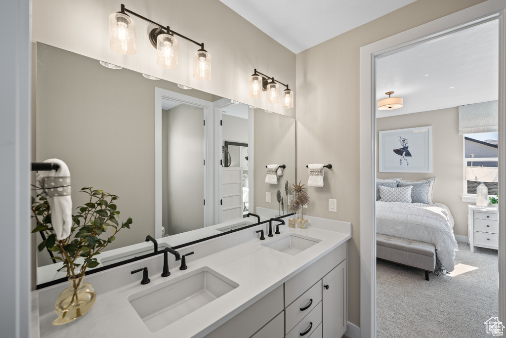 Ensuite bathroom featuring double vanity